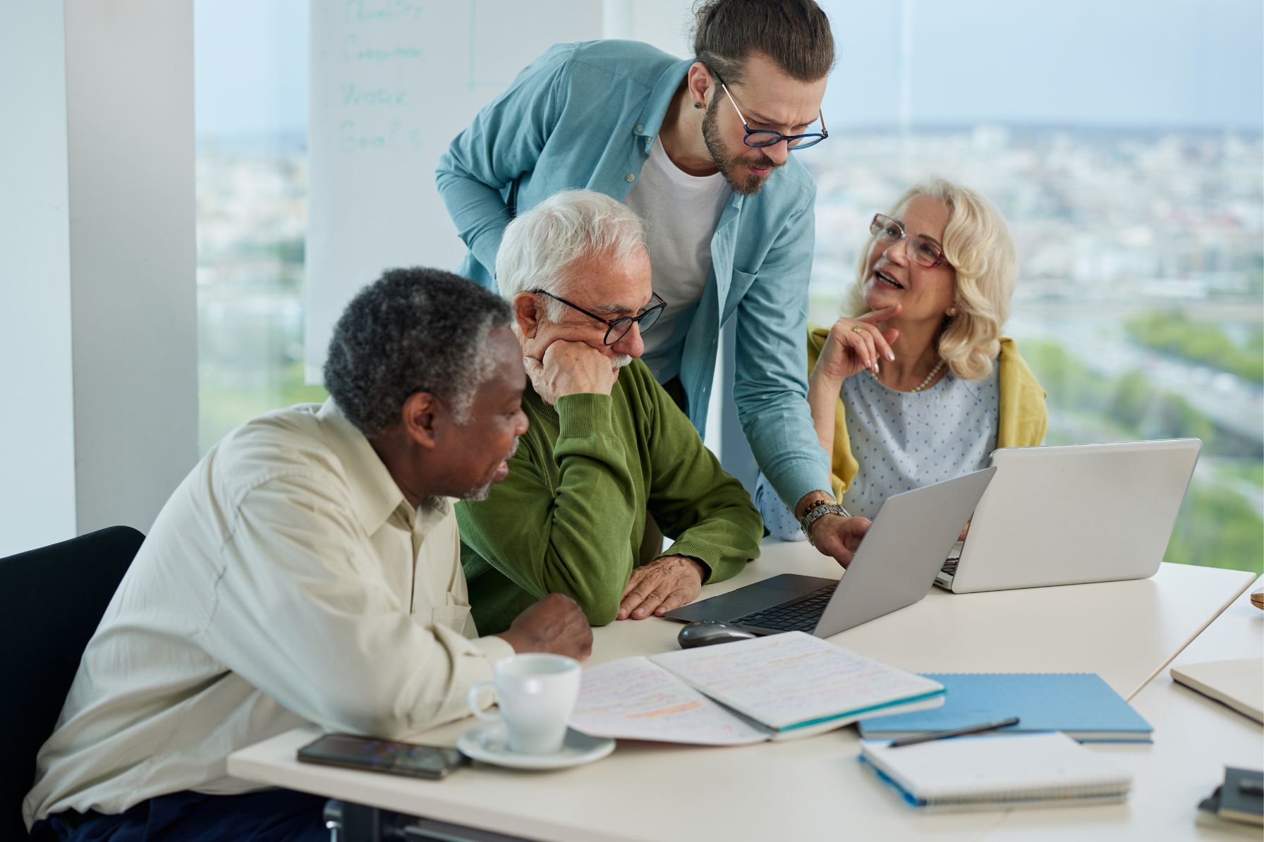 Adult Students Studying with a Teacher's Assistant