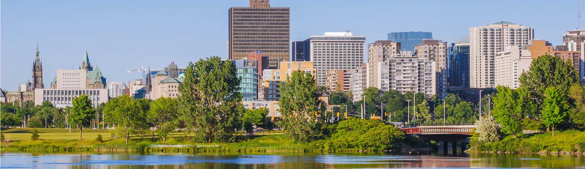 Ottawa skyline with Parliament buildings and riverfront park