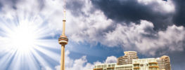 Toronto skyline with CN Tower under dramatic clouds