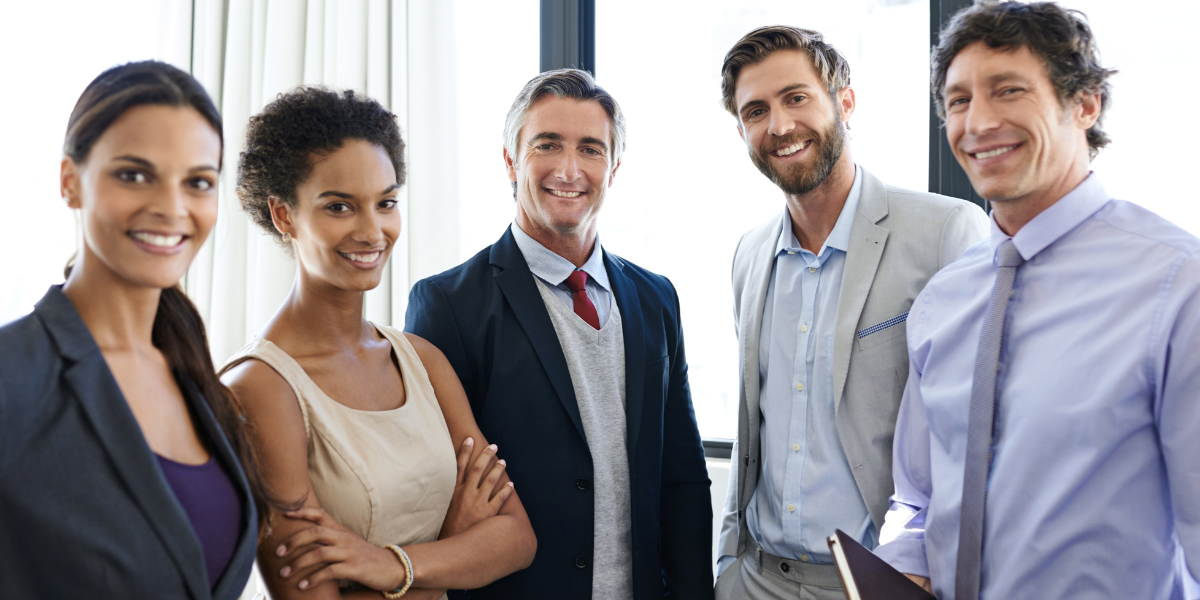paralegal vs. law clerk Legal team of law clerks and paralegals standing together in modern Canadian law firm office showing career opportunities in legal support roles