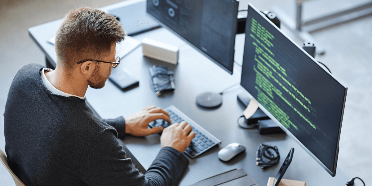 An IT professional working intently at their job, demonstrating the focus and dedication needed in career options for information technology grads.