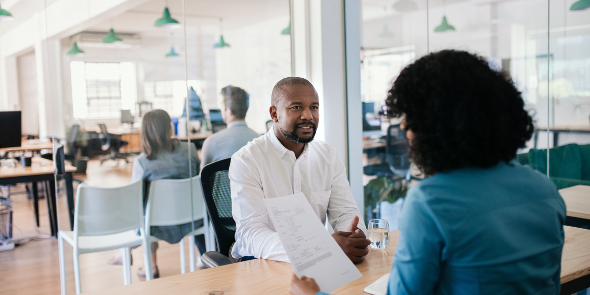 A professional seeking clarity on performance metrics, KPIs, and 30-60-90 day expectations during an interview conversation.