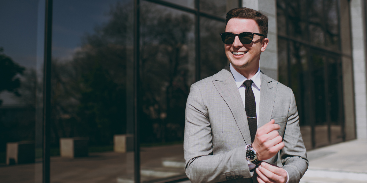 A man dressed in a grey suit, showcasing a balance of professionalism and approachability, ideal for job interviews.