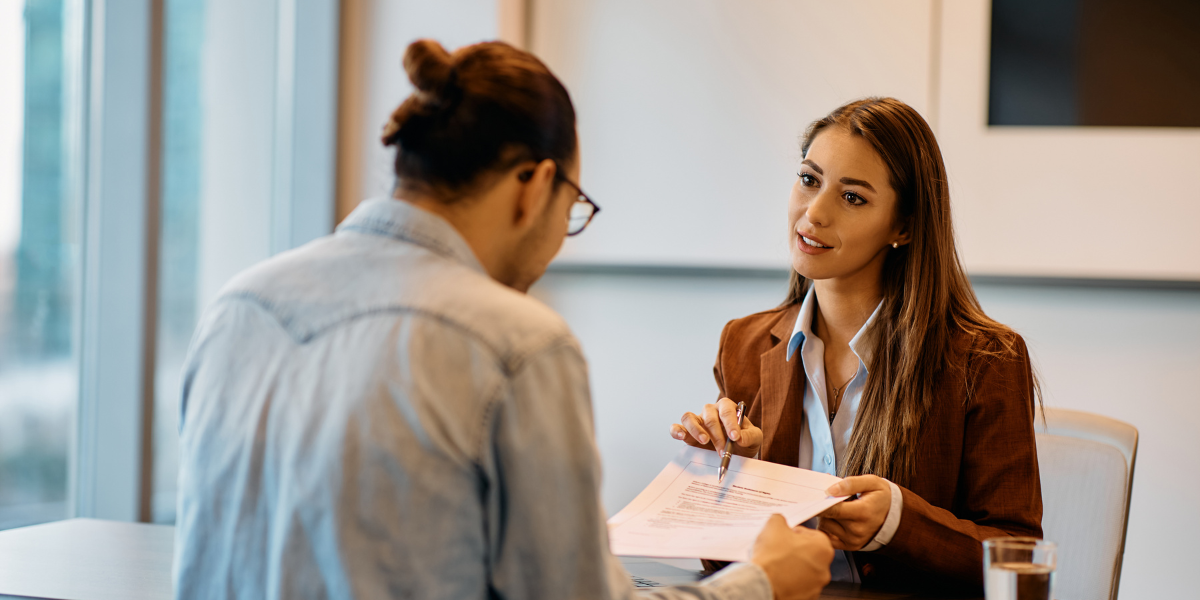 A human resources manager reviewing employee documents, demonstrating expertise gained from a one-year certificate program in HR management.