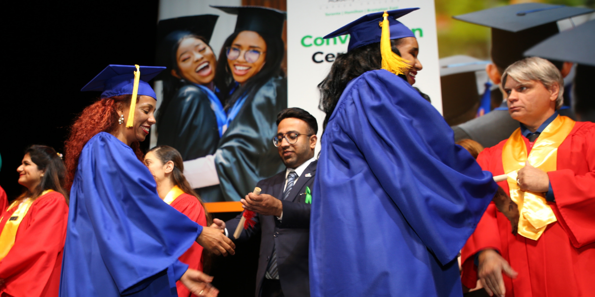 A successful female graduate in blue cap and gown celebrates her achievement at an Academy of Learning Career College convocation ceremony. AOLCC supports students throughout their educational journey with resources on RAP application process online and financial assistance programs.