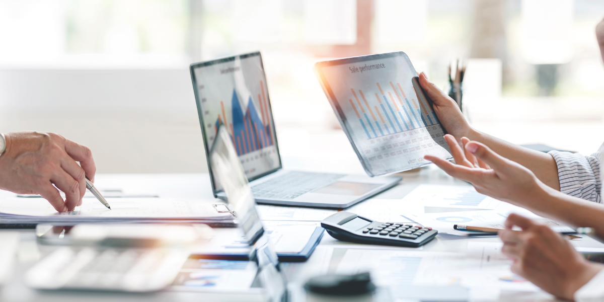 Microsoft Office Specialist certification A team working hard and utilizing Microsoft PowerPoint and Excel for their project.