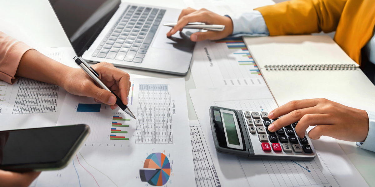 Administrative professional performing daily tasks like document handling, digital filing, and email correspondence in a modern office.